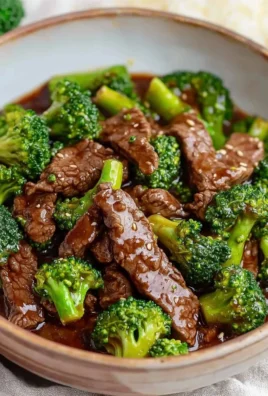 Delicious beef and broccoli stir-fry served in a bowl with rice