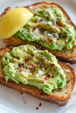 Plate of the best avocado toast topped with cherry tomatoes and sesame seeds