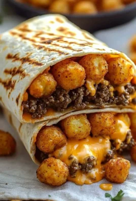 Delicious cheesy potato burritos served on a plate with toppings.