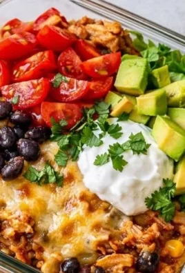Delicious Chicken Enchilada Bowl with chicken, rice, and fresh toppings