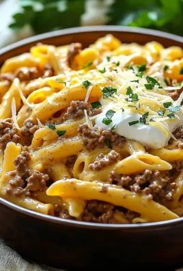 Creamy high protein beef pasta dish served in a bowl with herbs and spices