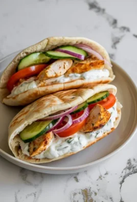 Crockpot Greek Chicken Pitas served with homemade Tzatziki sauce