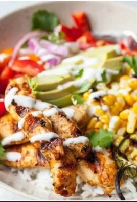 Grilled chicken burrito bowl with fresh vegetables and toppings