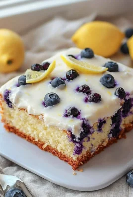 Lemon Blueberry Sheet Cake topped with fresh blueberries and lemon zest.