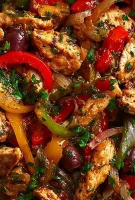 Delicious Mediterranean chicken stir fry with colorful vegetables in a skillet.