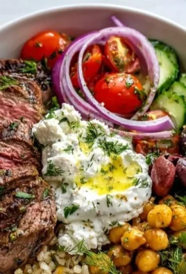 Delicious Mediterranean Steak Bowl with fresh vegetables and herbs