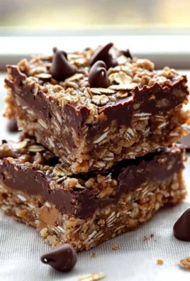 Delicious no-bake chocolate oatmeal bars on a wooden table