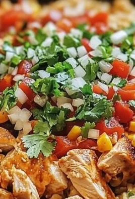 One-Pan Chicken Burrito Bowl with rice, chicken, beans, and fresh toppings