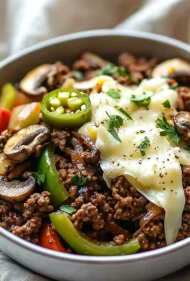 High protein, low carb Philly cheesesteak bowls on a wooden table