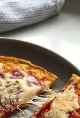 A delicious plate of Pizza Eggs topped with cheese and herbs, breakfast delight