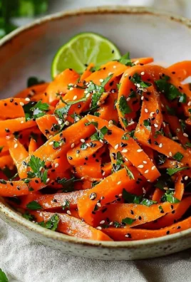 Fresh raw carrot salad with colorful vegetables and dressing