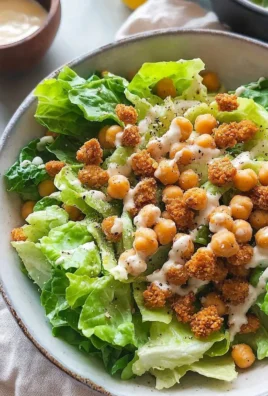 Simple romaine Caesar salad topped with crispy chickpea croutons
