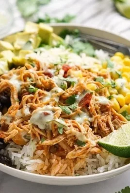 Slow Cooker Chicken Burrito Bowl with rice, chicken, and fresh toppings