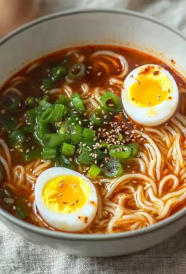 Spicy Gochujang Noodle Soup served in a bowl with fresh ingredients