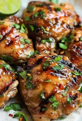 Delicious plate of Thai grilled chicken garnished with herbs