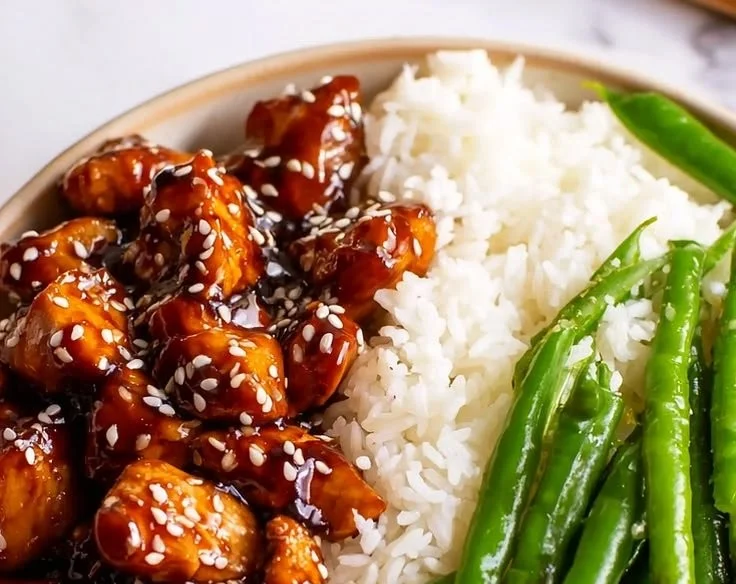 Asian High Protein Sesame Chicken dish with sesame seeds and vegetables