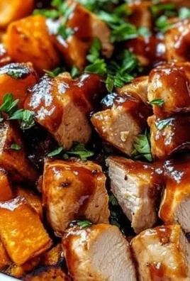 BBQ chicken sweet potato bowl topped with fresh ingredients and flavorful sauce