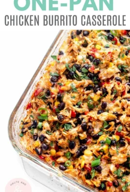 Baked Chicken Burrito Casserole with cheese and colorful toppings