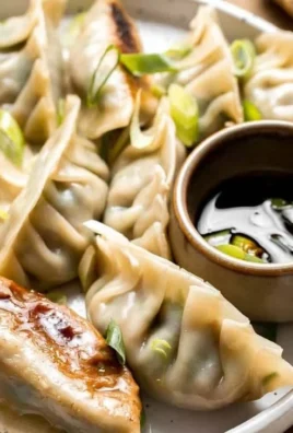 Chinese beef dumplings filled with celery served on a plate.