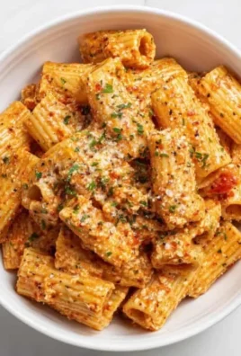 Delicious cottage cheese rigatoni pasta garnished with fresh herbs