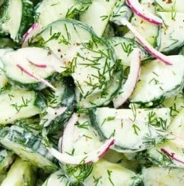 Fresh Cucumber Dill Salad in a bowl, garnished with dill fronds.