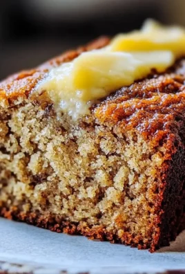 Delicious slice of moist banana bread with ripe bananas on the table