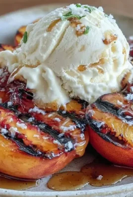 Delicious grilled peach dessert topped with honey and vanilla ice cream