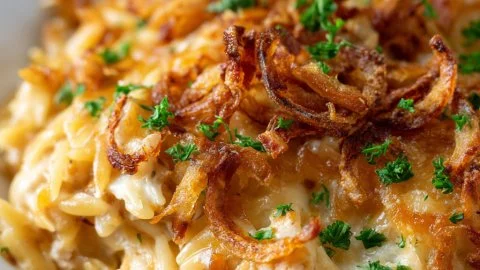 Delicious French onion chicken orzo casserole topped with melted cheese