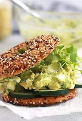 Gut-healthy avocado egg salad with vibrant ingredients served in a bowl.