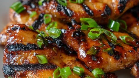 Plate of delicious Hawaiian Teriyaki Chicken garnished with herbs and sesame seeds