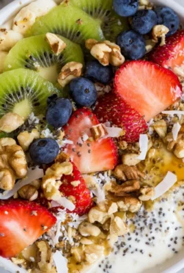 Healthy breakfast bowl filled with fruits, nuts, and grains for a nutritious start.