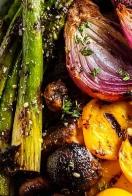 Plate of healthy grilled vegetables with asparagus and colorful bell peppers