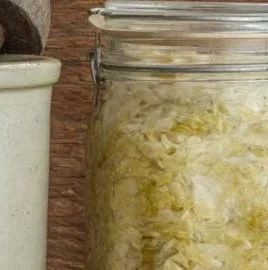 Homemade sauerkraut fermentation process in a crock