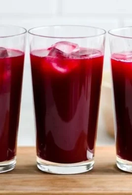 Refreshing watermelon cherry berry beet juice in a glass with fresh fruits