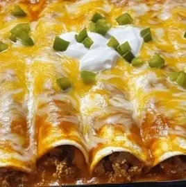 Keto Beef Enchiladas served with toppings in a vibrant dish