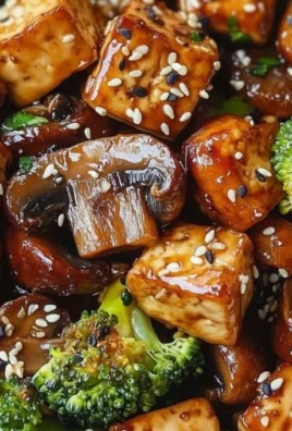Mushroom tofu stir-fry with vibrant vegetables in a skillet