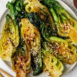 Quick stir-fried bok choy with garlic and ginger dish.