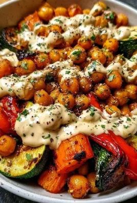 Roasted Vegetable & Chickpea Bowl garnished with fresh herbs and spices