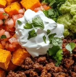 Savory sweet potato taco bowl with fresh toppings for a delicious meal