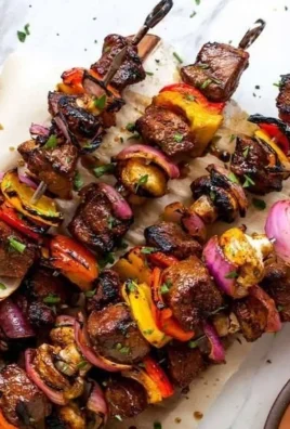 Delicious steak kabobs skewered with fresh vegetables and grilled