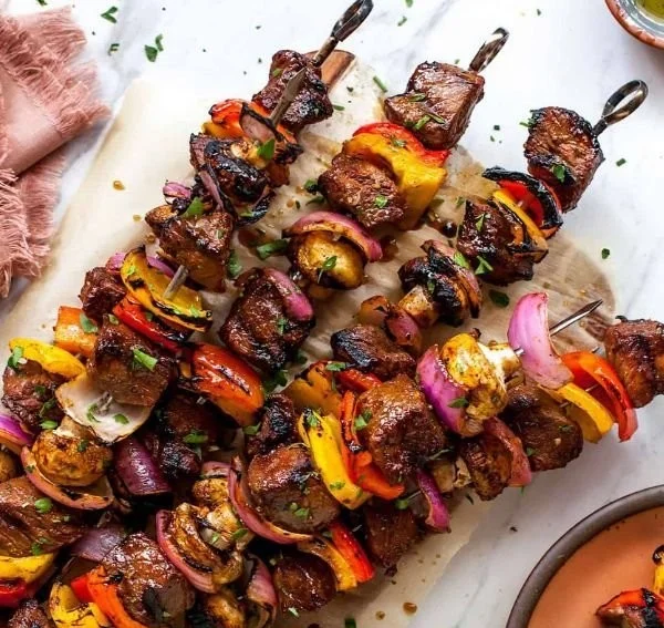 Grilled steak kabobs with colorful vegetables on skewers