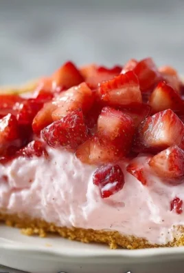 Delicious Strawberry Cool Whip Pie topped with fresh strawberries and whipped cream