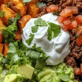 Delicious sweet potato taco bowl filled with vibrant veggies and toppings