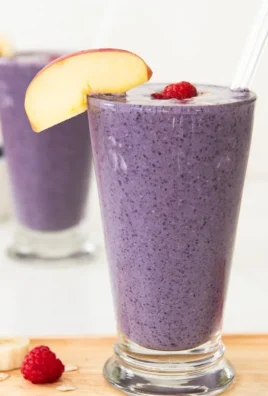 Delicious high fiber smoothie in a glass with fresh fruits and greens