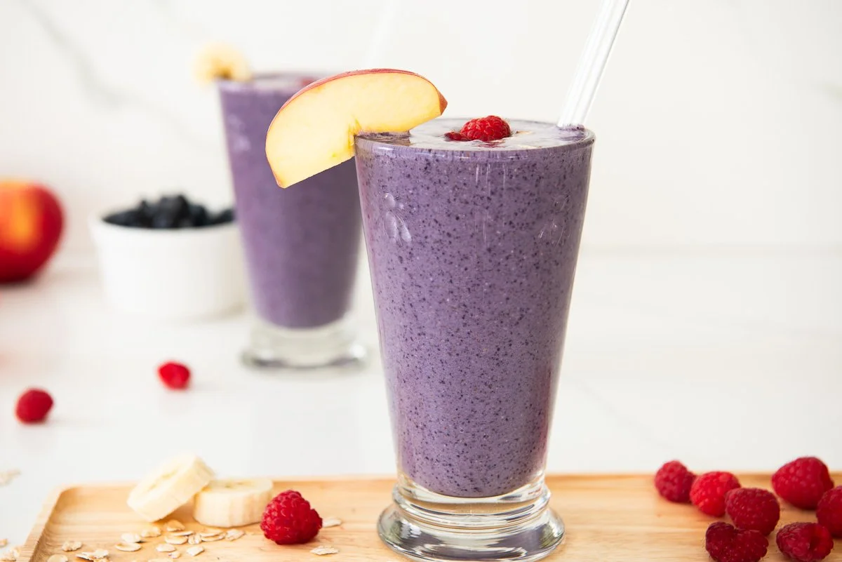 Delicious high fiber smoothie in a glass with fresh fruits and greens