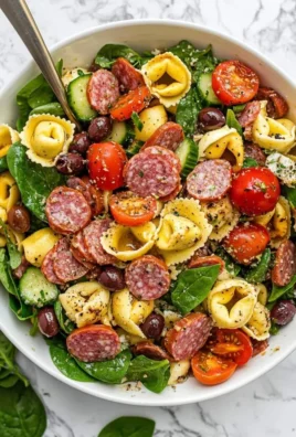 Colorful Tortellini Pasta Salad with fresh vegetables in a bowl