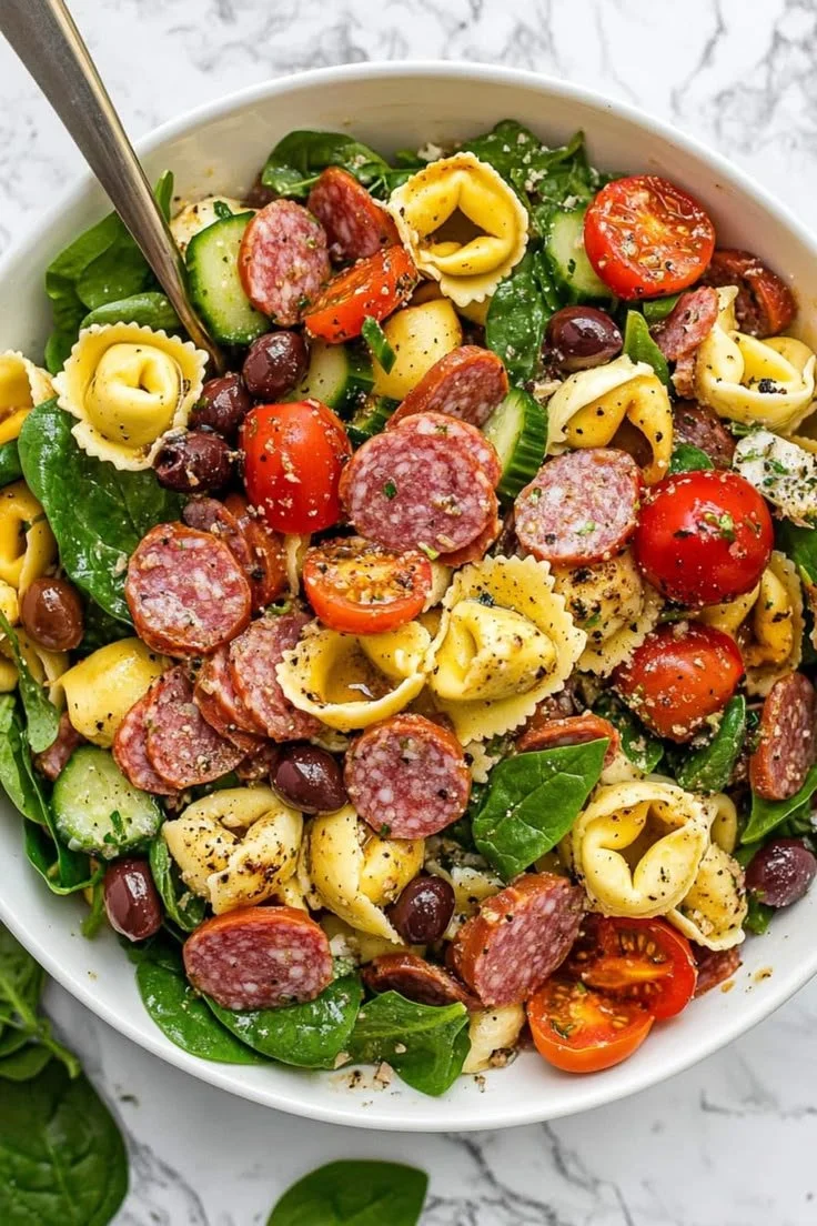 Colorful Tortellini Pasta Salad with fresh vegetables in a bowl