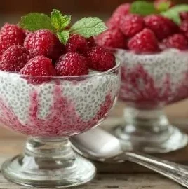 Delicious Vanilla Raspberry Chia Pudding topped with fresh raspberries and vanilla essence.