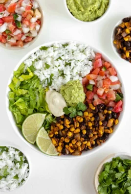 Colorful vegan burrito bowl filled with quinoa, black beans, and fresh vegetables