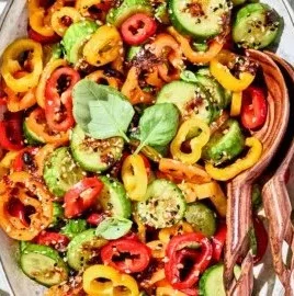 Viral TikTok cucumber and bell pepper salad served in a bowl